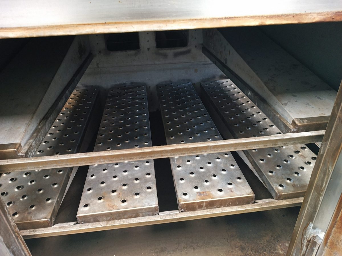 Clean conveyor oven finger plates after a service