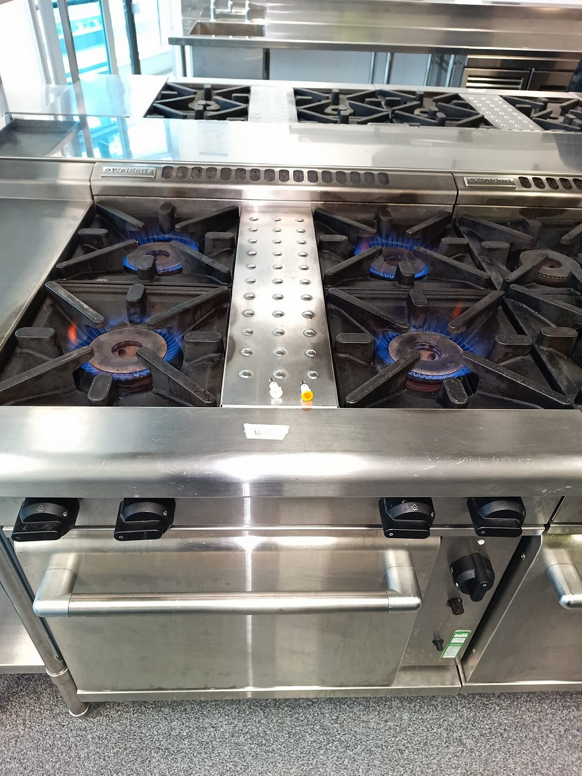 Commercial gas range burners lit