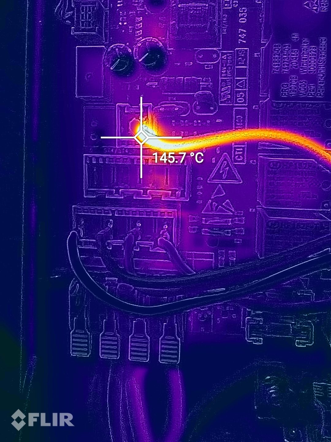 Thermal image of a dishwasher circuit board showing an overheating track
